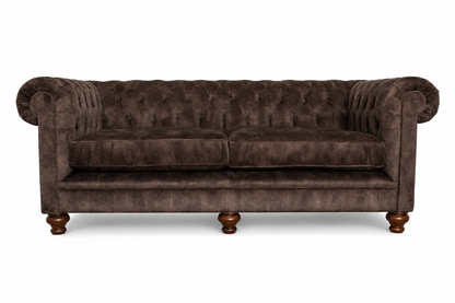 Brown velvet sofa on a white background