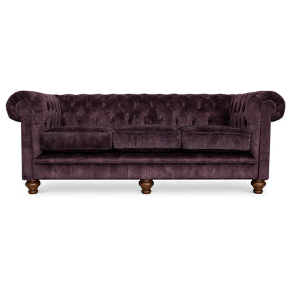 Purple velvet 4 seater sofa on white bakcground 