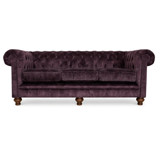 Purple velvet 4 seater sofa on white bakcground 