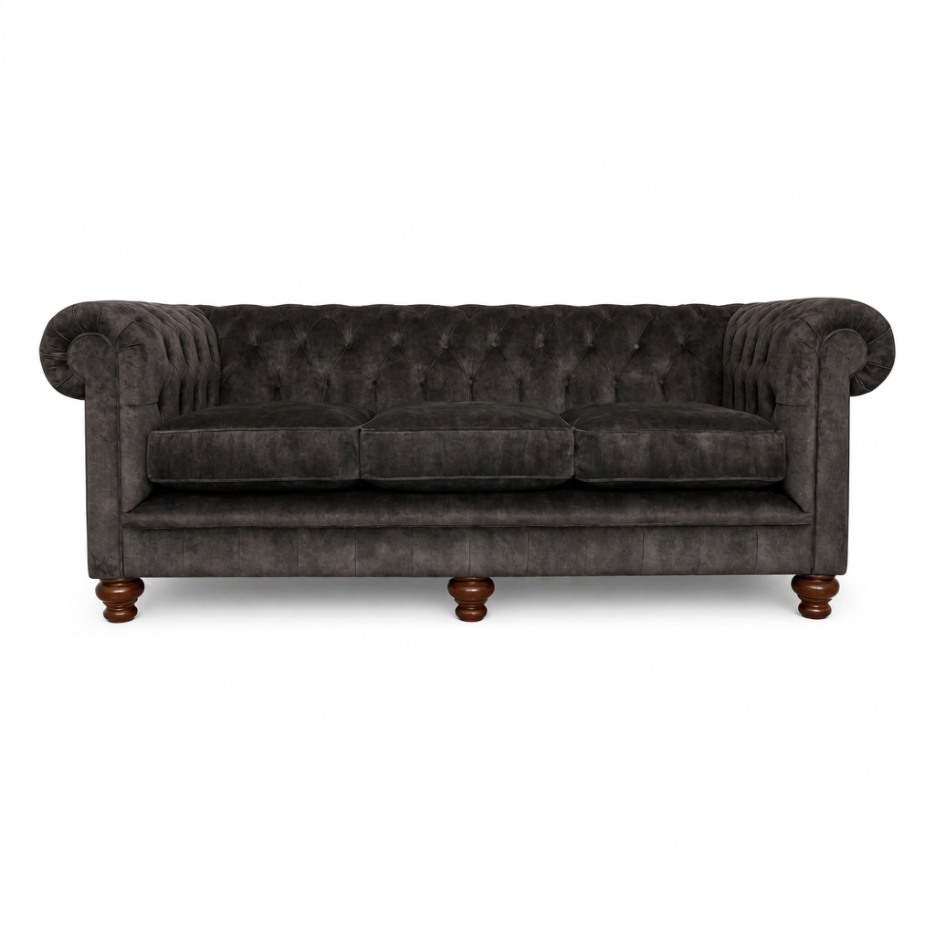 Dark gray tufted sofa with wooden legs on a white background