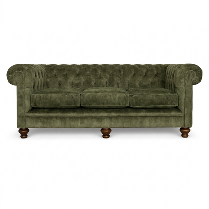 Green velvet sofa with wooden legs on a white background