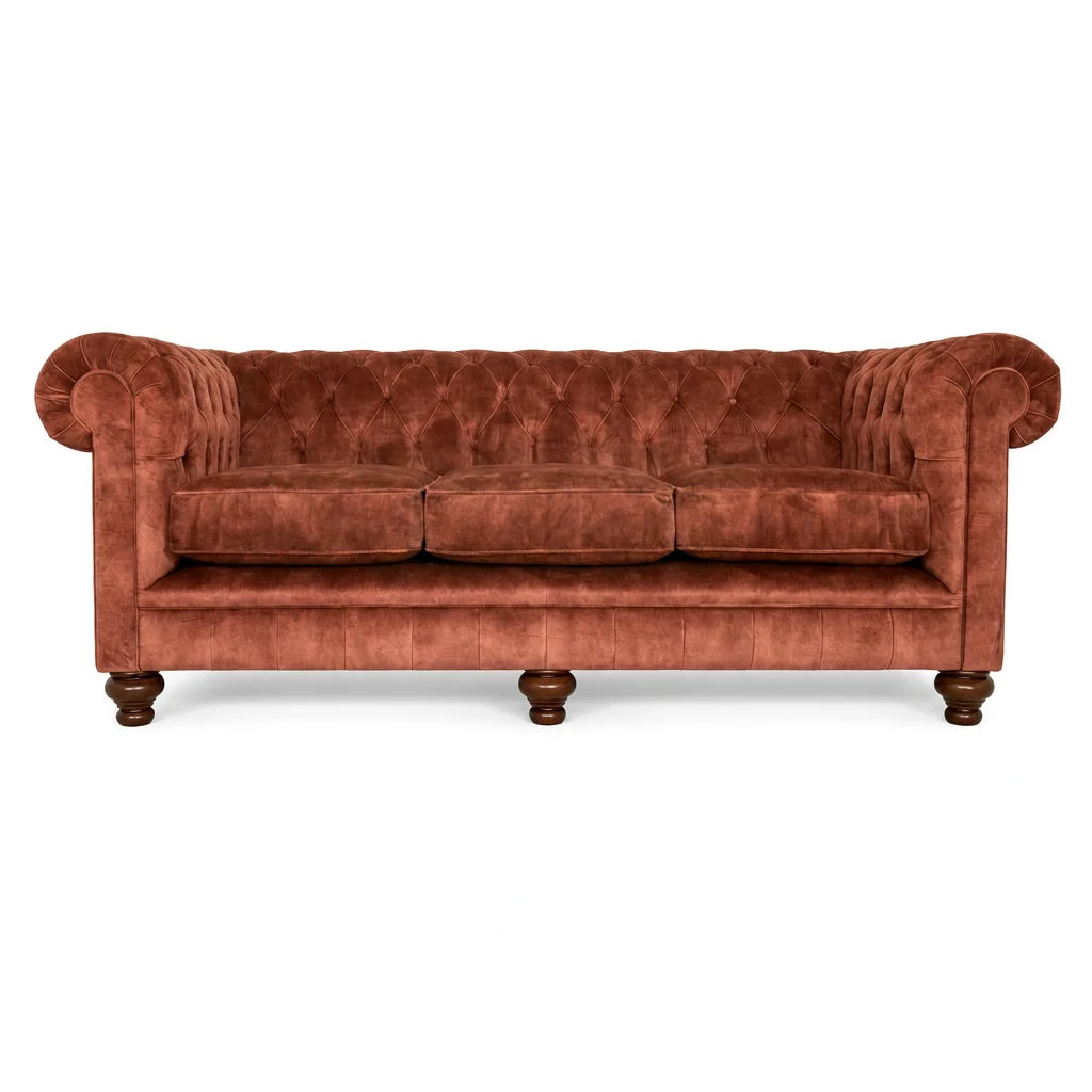 Brown velvet sofa with wooden legs on a white background