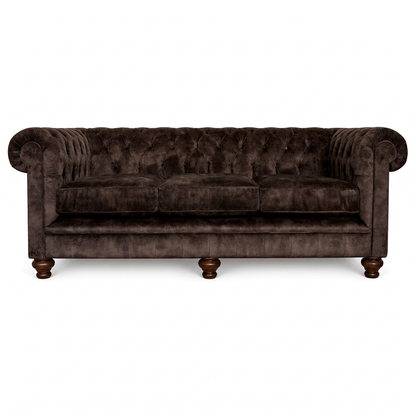Brown velvet sofa on a white background