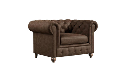 Brown leather chesterfield sofa against a textured wall.