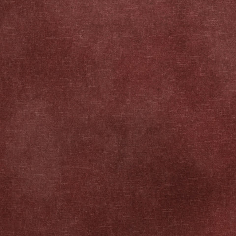 A close-up of a textured fabric or material swatch in a muted burgundy red color.