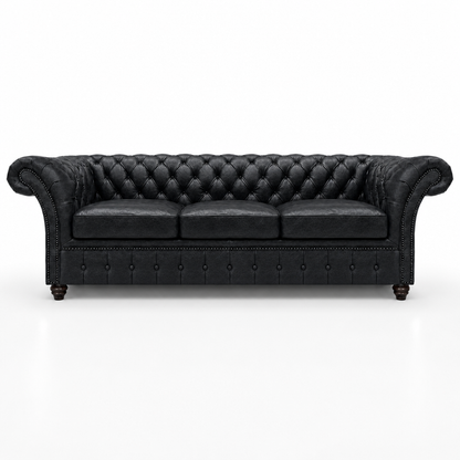 Black leather sofa with tufted backrest on a white background