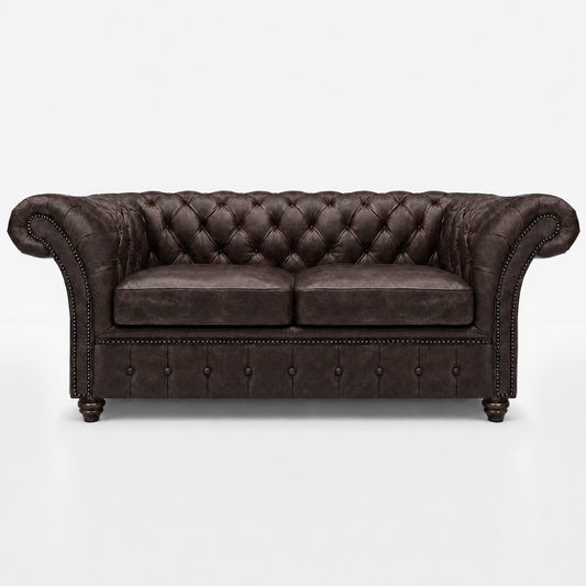 Brown leather sofa with tufted backrest on a white background