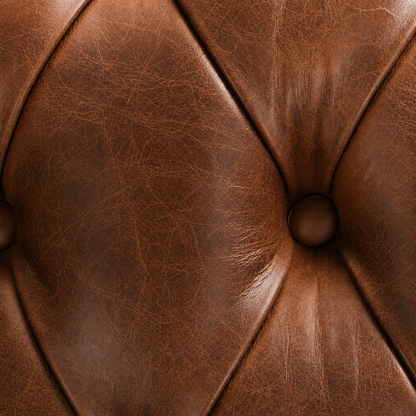 Close-up of brown leather with a button detail