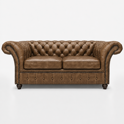 Brown leather sofa with tufted backrest on a white background