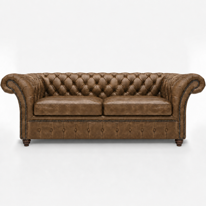 Brown leather sofa with tufted backrest on a white background