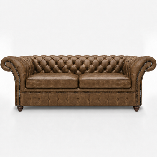 Brown leather sofa with tufted backrest on a white background