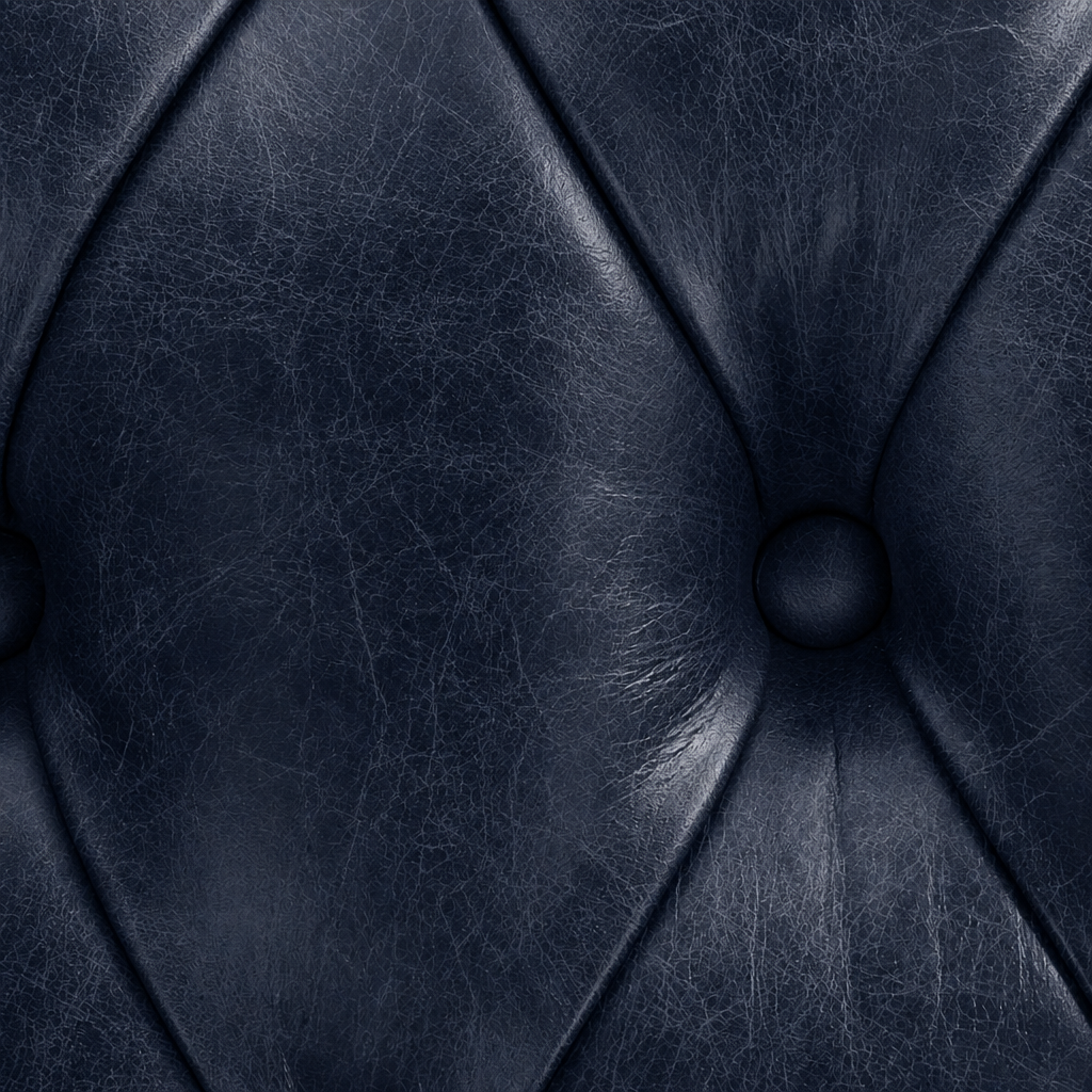 Close-up of a dark blue leather texture with stitching