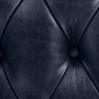 Close-up of a dark blue leather texture with stitching