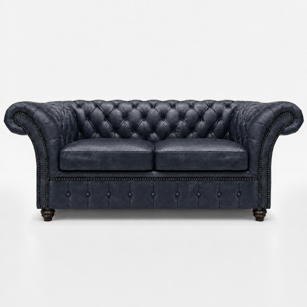 Dark gray leather sofa with tufted backrest on a white background