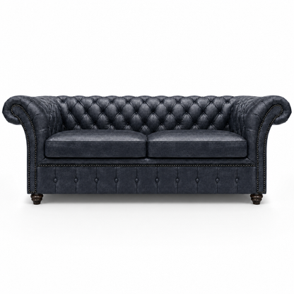 Black leather sofa with tufted backrest on a white background