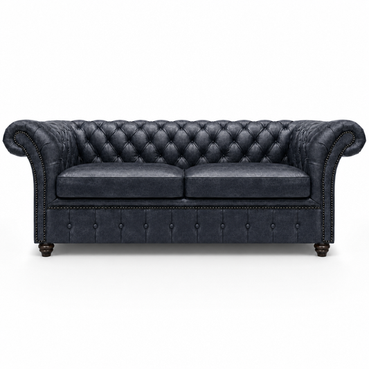 Black leather sofa with tufted backrest on a white background