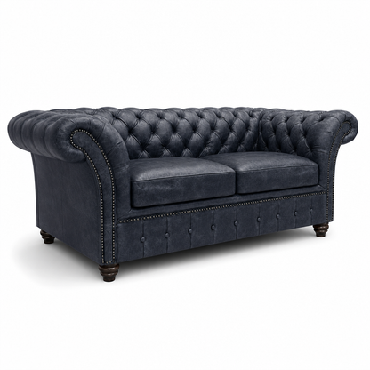 Blue tufted sofa on a white background