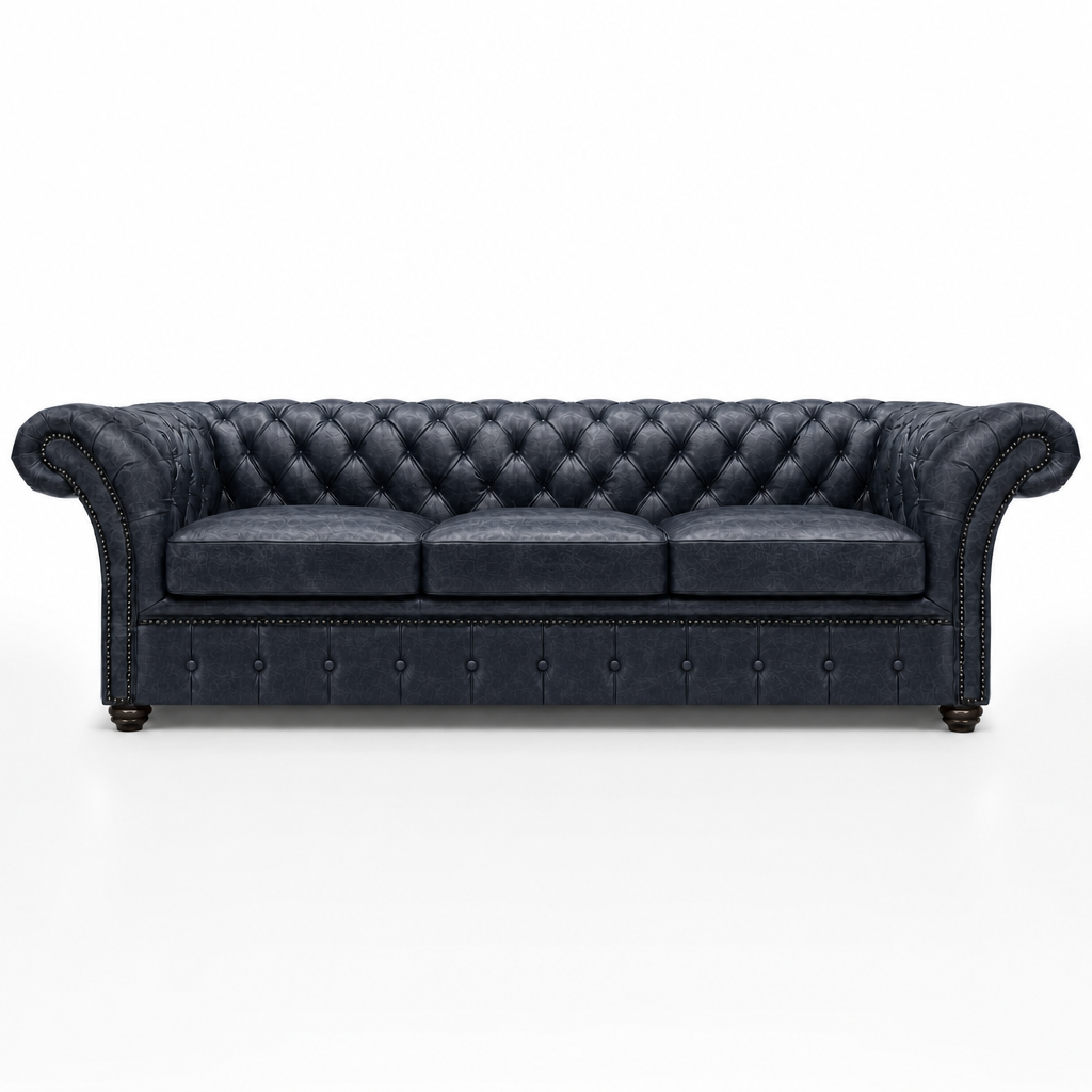Dark blue tufted sofa on a white background