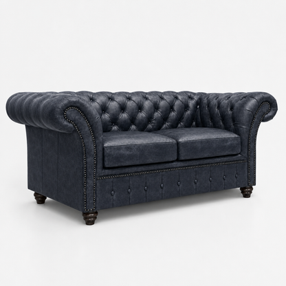 Blue tufted sofa on a white background