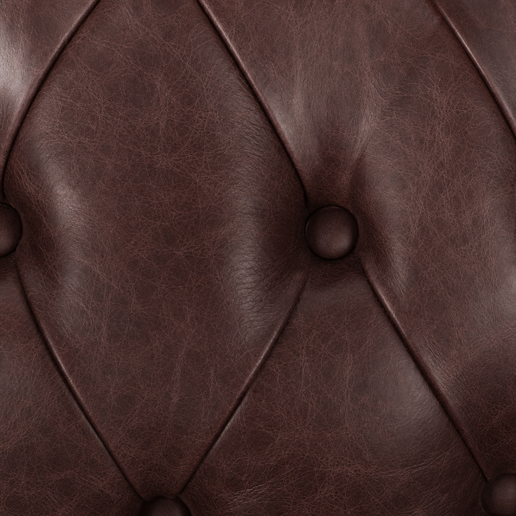 Close-up of brown leather with tufted design